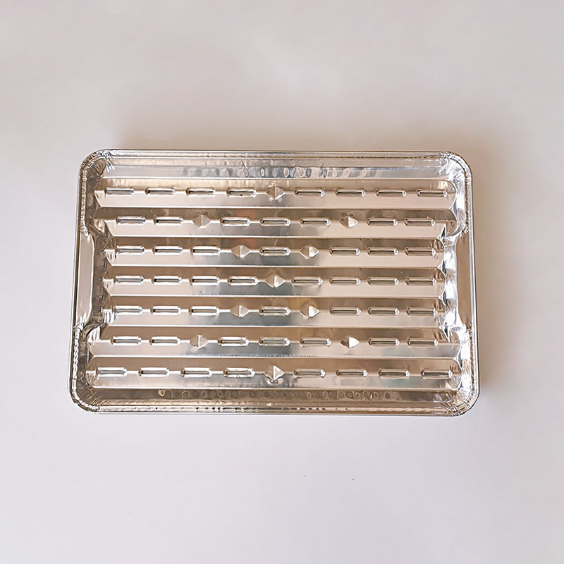 Po&ecirc;le de cuisson ext&eacute;rieure pour barbecue avec poign&eacute;e